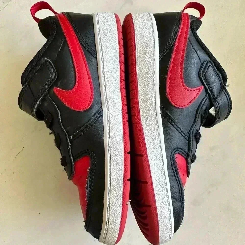 Black and red Nike Kids shoes